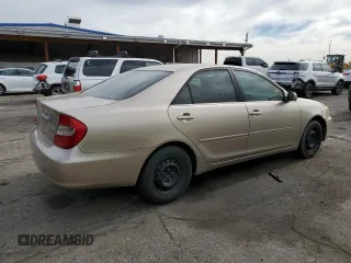 2002 Toyota Camry LE z VIN 4T1BE32K92U524457, wystawiony jako Copart lot #56864365 z przebiegiem 274 760 mil mil oraz Czysty tytuł • Clean title. Historia ofert i sprzedaży dostępna na DreamBid. Obrazek 3.