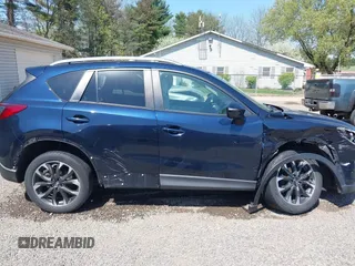 2016 Mazda CX-5 Grand Touring with VIN JM3KE4DY5G0681369, listed as a IAAI auction lot 42102805 with 128,182 mi miles and . Bid and sale history available at DreamBid. Image 13.