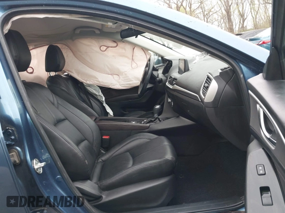 2018 Mazda 3 Touring with VIN 3MZBN1V35JM217641, listed as a IAAI auction lot 41943433 with 64,884 mi miles. Bid and sale history available at carsss.com. Image 5.