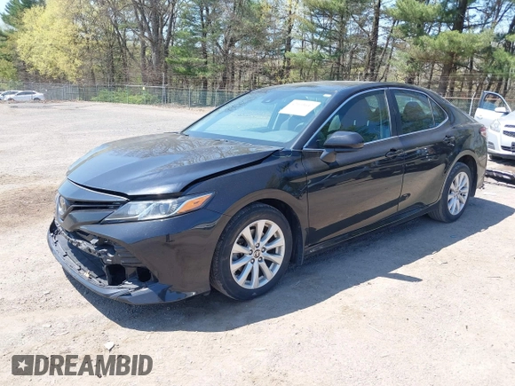 2020 Toyota Camry LE with VIN 4T1C11AK9LU387012, listed as a IAAI auction lot 42103647 with 64,049 mi miles and . Bid and sale history available at carsss.com. Image 2.