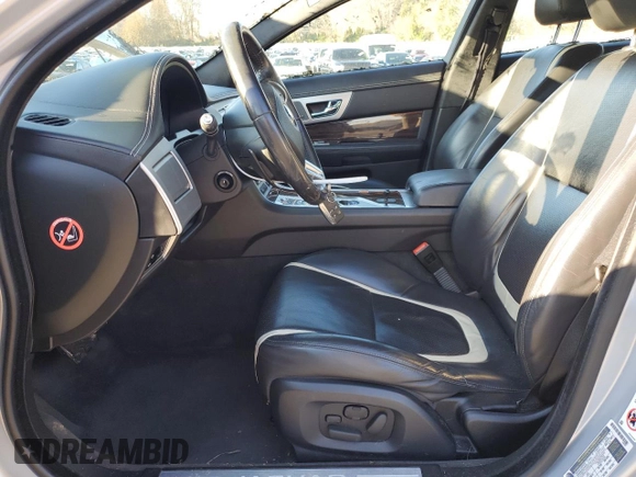 2015 Jaguar XF V6 Portfolio with VIN SAJWA0F7XF8U51105, listed as a Copart auction lot 82865814 with 62,807 mi miles and Salvage Title. Bid and sale history available at carsss.com. Image 7.