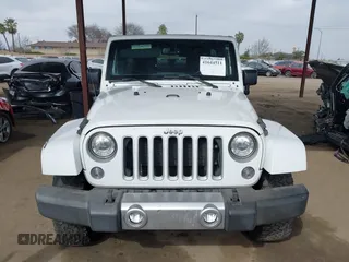 2017 Jeep Wrangler Unlimited Sahara with VIN 1C4HJWEG0HL595144, listed as a IAAI auction lot 41644511 with 143,512 mi miles. Bid and sale history available at carsss.com. Image 13.