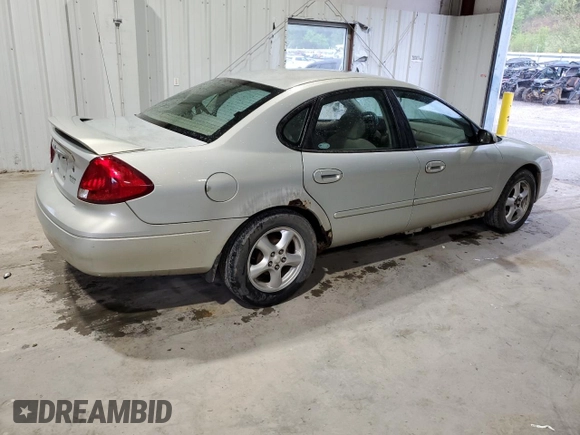 2003 Ford Taurus SE Standard z VIN 1FAFP532X3A195612, wystawiony jako Copart lot #54016645 z przebiegiem 143 168 mil mil oraz Szkoda całkowita • Salvage title. Historia ofert i sprzedaży dostępna na DreamBid. Obrazek 3.