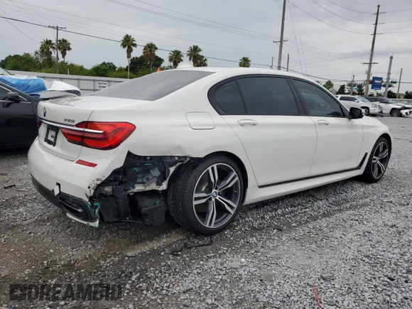 2016 BMW 7 Series 740i with VIN WBA7E2C52GG547112, listed as a Copart auction lot 63069355 with 76,867 mi miles and Salvage title. Bid and sale history available at DreamBid. Image 3.
