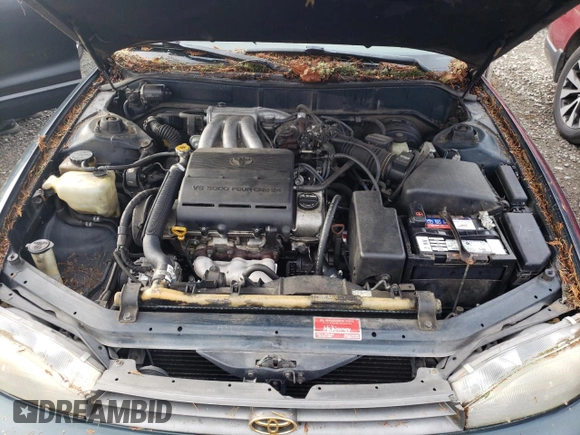 1994 Toyota Camry XLE with VIN JT2GK13E2R0008225, listed as a Copart auction lot 83668084 with 258,735 mi miles and Salvage Title. Bid and sale history available at carsss.com. Image 11.