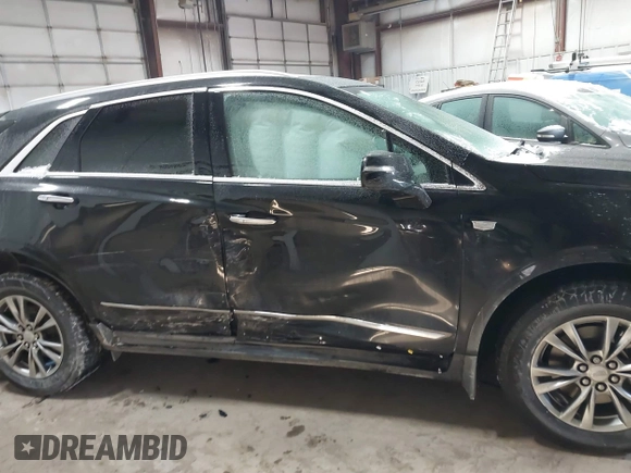 2021 Cadillac XT5 FWD Premium Luxury with VIN 1GYKNCRS3MZ198651, listed as a IAAI auction lot 41607734 with 49,275 mi miles. Bid and sale history available at carsss.com. Image 13.