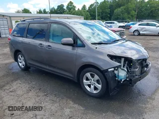 2014 Toyota Sienna LE AAS with VIN 5TDKK3DCXES415971, listed as a IAAI auction lot 42519554 with 113,559 mi miles and . Bid and sale history available at DreamBid. Image 1.