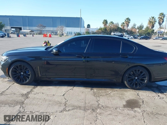 2022 BMW 7 Series 740i with VIN WBA7T2C02NCJ33925, listed as a IAAI auction lot 41377788 with 143,684 mi miles and . Bid and sale history available at carsss.com. Image 14.