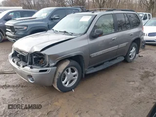 2005 GMC Envoy SLT with VIN 1GKDT13S752276414, listed as a IAAI auction lot 41052684 with 200,919 mi miles. Bid and sale history available at carsss.com. Image 2.