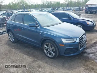 2018 Audi Q3 Premium Plus z VIN WA1JCCFSXJR012749, wystawiony jako IAAI lot #42128746 z przebiegiem 66 022 mil mil oraz . Historia ofert i sprzedaży dostępna na DreamBid. Obrazek 1.