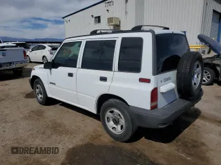 1996 Geo Tracker z VIN 2CNBE1364T6909947, wystawiony jako Copart lot #54411835 z przebiegiem 171 862 mil mil oraz Szkody całkowita. Historia ofert i sprzedaży dostępna na DreamBid. Obrazek 2.