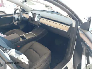 2024 Tesla Model Y Long Range with VIN 7SAYGAEEXRF988561, listed as a IAAI auction lot 42058248 with 7,845 mi miles. Bid and sale history available at carsss.com. Image 5.