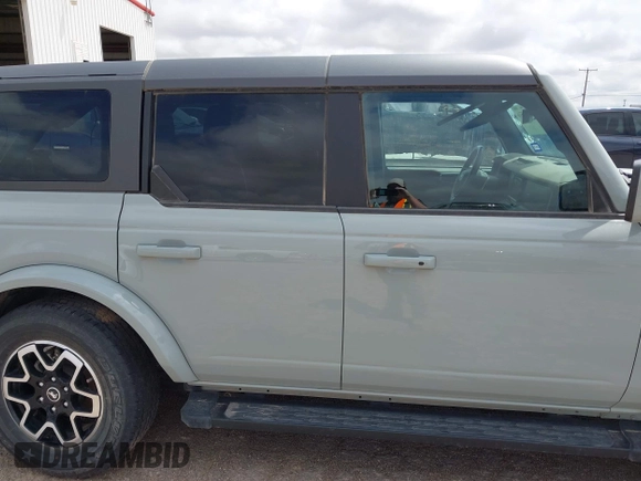 2023 Ford Bronco z VIN 1FMEE5BP9PLA97587, wystawiony jako IAAI lot #42168516 z przebiegiem 29 622 mil mil oraz . Historia ofert i sprzedaży dostępna na DreamBid. Obrazek 13.