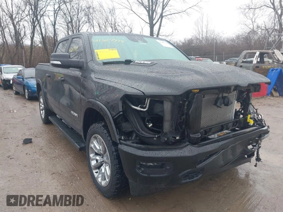 2021 Ram 1500 Laramie with VIN 1C6SRFJT6MN580803, listed as a IAAI auction lot 41207914 with 56,891 mi miles and . Bid and sale history available at DreamBid. Image 1.