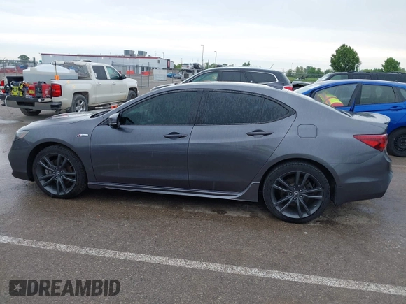 2019 Acura TLX w/A-Spec Pkg z VIN 19UUB2F61KA000932, wystawiony jako IAAI lot #42164064 z przebiegiem 79 080 mil mil oraz . Historia ofert i sprzedaży dostępna na DreamBid. Obrazek 14.