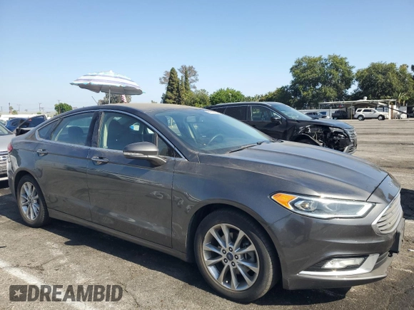 2017 Ford Fusion SE with VIN 3FA6P0HD7HR247627, listed as a Copart auction lot 61872975 with 230,032 mi miles and Salvage title. Bid and sale history available at DreamBid. Image 4.