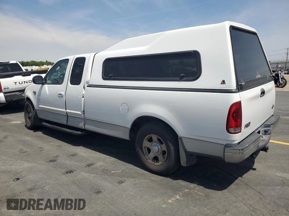 2003 Ford F-150 XL with VIN 2FTRX17L23CA17128, listed as a Copart auction lot 60144965 with 121,055 mi miles and Salvage title. Bid and sale history available at DreamBid. Image 2.