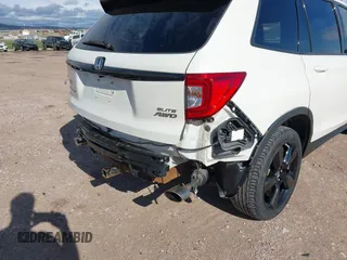 2019 Honda Passport Elite z VIN 5FNYF8H0XKB001472, wystawiony jako IAAI lot #42143890 z przebiegiem 98 119 mil mil oraz . Historia ofert i sprzedaży dostępna na DreamBid. Obrazek 19.