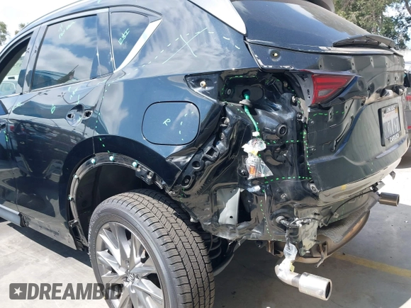 2020 Mazda CX-5 Grand Touring with VIN JM3KFADM3L1819939, listed as a IAAI auction lot 42749920 with 35,407 mi miles and . Bid and sale history available at DreamBid. Image 6.
