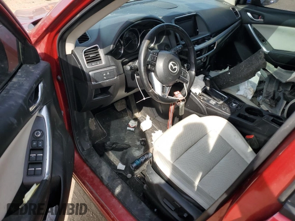 2016 Mazda CX-5 Grand Touring z VIN JM3KE2DY2G0705650, wystawiony jako Copart lot #53808365 z przebiegiem 123 611 mil mil oraz Szkoda całkowita • Salvage title. Historia ofert i sprzedaży dostępna na DreamBid. Obrazek 8.