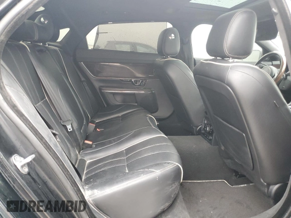 2014 Jaguar XJ Portfolio z VIN SAJWA2GZ2E8V64993, wystawiony jako Copart lot #88774965 z przebiegiem Nie podano mil oraz Szkoda całkowita • Salvage title. Historia ofert i sprzedaży dostępna na DreamBid. Obrazek 10.