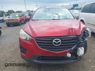 2016 Mazda CX-5 Sport with VIN JM3KE4BY3G0635882, listed as a IAAI auction lot 42545799 with 144,247 mi miles and . Bid and sale history available at DreamBid. Image 12.
