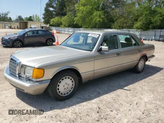 1991 Mercedes-Benz 560 with VIN WDBCA39E9MA599487, listed as a Copart auction lot 51921915 with 59,132 mi miles and Salvage Title. Bid and sale history available at DreamBid. Image 1.