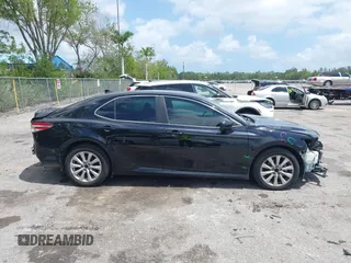 2020 Toyota Camry LE with VIN 4T1C11AK1LU986972, listed as a IAAI auction lot 41966639 with 97,617 mi miles and . Bid and sale history available at carsss.com. Image 12.