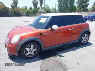2011 MINI Hardtop with VIN WMWSU3C50BT094515, listed as a IAAI auction lot 42500608 with 154,534 mi miles and . Bid and sale history available at DreamBid. Image 2.