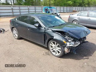 2016 Mazda Mazda6 i Touring with VIN JM1GJ1V51G1475599, listed as a IAAI auction lot 42059432 with 216,730 mi miles. Bid and sale history available at carsss.com. Image 1.
