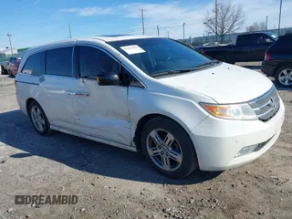 2012 Honda Odyssey Touring with VIN 5FNRL5H96CB010696, listed as a IAAI auction lot 41605868 with 109,411 mi miles and . Bid and sale history available at carsss.com. Image 1.