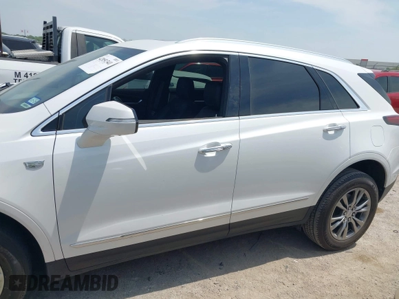 2021 Cadillac XT5 FWD Premium Luxury z VIN 1GYKNCR42MZ174309, wystawiony jako IAAI lot #42051341 z przebiegiem 75 544 mil mil oraz . Historia ofert i sprzedaży dostępna na DreamBid. Obrazek 14.