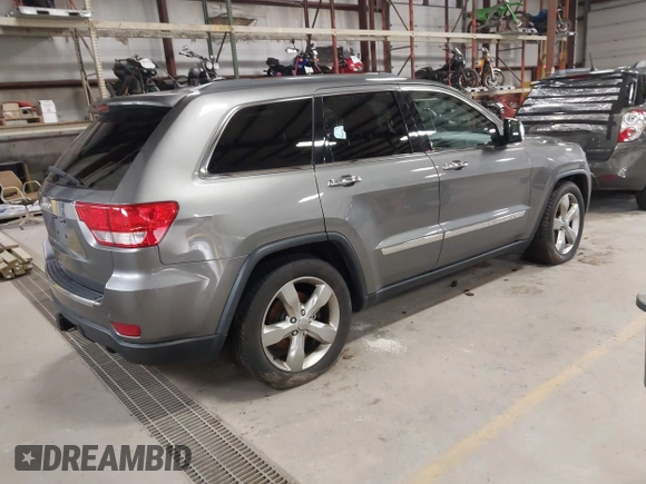 2013 Jeep Grand Cherokee Overland with VIN 1C4RJFCT9DC524605, listed as a IAAI auction lot 42016103 with 215,352 mi miles. Bid and sale history available at carsss.com. Image 4.
