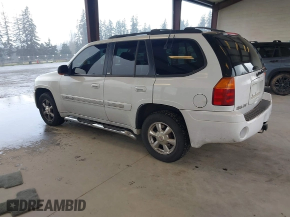2003 GMC Envoy SLE with VIN 1GKDT13SX32319740, listed as a IAAI auction lot 41923578 with 210,811 mi miles. Bid and sale history available at carsss.com. Image 3.