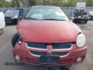 2004 Dodge Neon SXT with VIN 1B3ES56C04D504384, listed as a IAAI auction lot 41988581 with 166,602 mi miles. Bid and sale history available at carsss.com. Image 13.