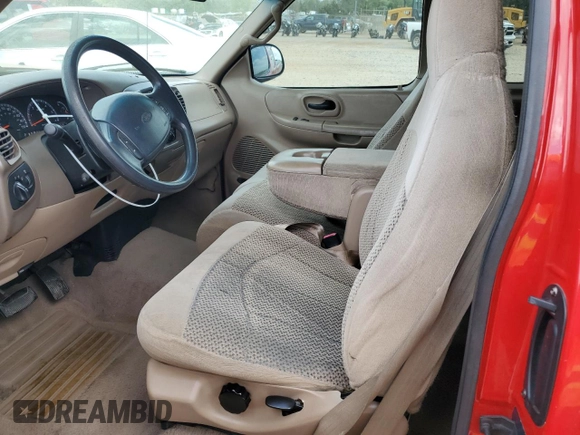 1999 Ford F-150 with VIN 1FTZX1725XNA33332, listed as a Copart auction lot 51867455 with 163,023 mi miles and Salvage title. Bid and sale history available at DreamBid. Image 7.