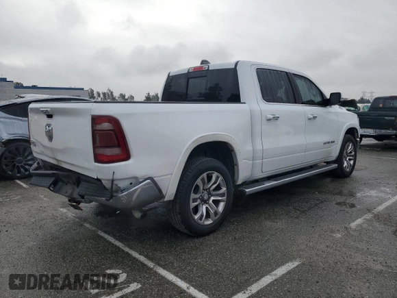 2020 Ram 1500 with VIN 1C6RREKG4LN401571, listed as a Copart auction lot 43620245 with 99,979 mi miles and Salvage title. Bid and sale history available at DreamBid. Image 3.
