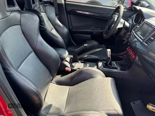 2012 Mitsubishi Lancer Evolution GSR z VIN JA32W8FV0CU019216, wystawiony jako Copart lot #75898944 z przebiegiem 129 387 mil mil oraz Tytuł czysty. Historia ofert i sprzedaży dostępna na DreamBid. Obrazek 5.