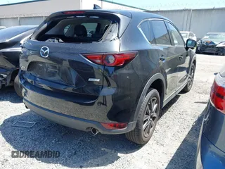 2018 Mazda CX-5 Grand Touring with VIN JM3KFADM4J0326760, listed as a IAAI auction lot 41885100 with 82,091 mi miles and . Bid and sale history available at DreamBid. Image 4.
