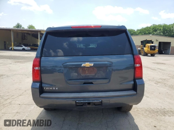 2020 Chevrolet Tahoe LT with VIN 1GNSKBKC0LR260766, listed as a Copart auction lot 61465725 with 104,850 mi miles and Salvage title. Bid and sale history available at DreamBid. Image 6.
