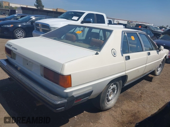 1985 Maserati Quattroporte z VIN ZAMBC1103FA305124, wystawiony jako IAAI lot #42164927 z przebiegiem 117 000 mil mil oraz . Historia ofert i sprzedaży dostępna na DreamBid. Obrazek 4.