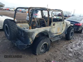 2003 Jeep Wrangler Sport with VIN 1J4FA49S93P374406, listed as a IAAI auction lot 41648982 with Not provided miles and . Bid and sale history available at DreamBid. Image 4.
