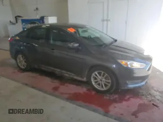 2018 Ford Focus SE z VIN 1FADP3F25JL257815, wystawiony jako Copart lot #61978045 z przebiegiem 62 328 mil mil oraz Szkoda całkowita • Salvage title. Historia ofert i sprzedaży dostępna na DreamBid. Obrazek 4.