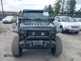 2014 Jeep Wrangler Unlimited Sahara with VIN 1C4BJWEG6EL107526, listed as a IAAI auction lot 42030244 with 69,077 mi miles. Bid and sale history available at carsss.com. Image 12.
