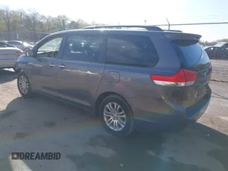 2014 Toyota Sienna XLE with VIN 5TDYK3DC5ES475750, listed as a IAAI auction lot 41976805 with 221,804 mi miles. Bid and sale history available at carsss.com. Image 3.