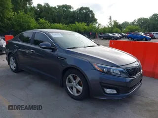 2015 Kia Optima LX z VIN KNAGM4A77F5627504, wystawiony jako IAAI lot #42582787 z przebiegiem 164 008 mil mil oraz . Historia ofert i sprzedaży dostępna na DreamBid. Obrazek 1.