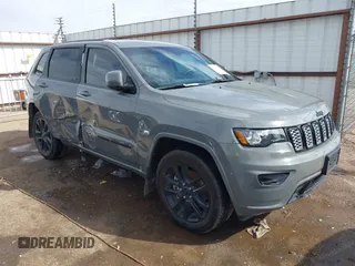 2021 Jeep Grand Cherokee Laredo X with VIN 1C4RJEAG5MC824738, listed as a IAAI auction lot 41580995 with 57,923 mi miles. Bid and sale history available at carsss.com. Image 1.