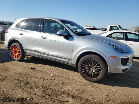 2018 Porsche Cayenne with VIN WP1AA2A21JKA05743, listed as a Copart auction lot 42643605 with 76,927 mi miles and Salvage Title. Bid and sale history available at carsss.com. Image 4.