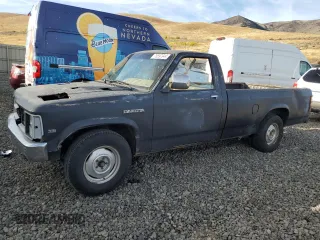 1988 Dodge Dakota z VIN 1B7GN14X5JS776983, wystawiony jako Copart lot #76597944 z przebiegiem 133 654 mil mil oraz Czysty tytuł • Clean title. Historia ofert i sprzedaży dostępna na DreamBid. Obrazek 1.
