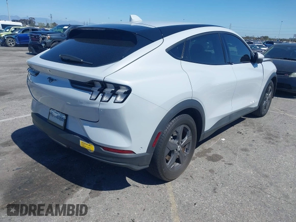 2021 Ford Mustang Mach-E Select z VIN 3FMTK1RM7MMA57653, wystawiony jako IAAI lot #41822938 z przebiegiem 23 581 mil mil oraz . Historia ofert i sprzedaży dostępna na DreamBid. Obrazek 4.